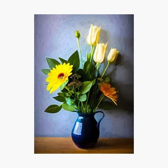 Yellow flowers in vase with handle